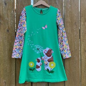 Mini Boden green dress with floral sleeves with Guinea Pigs and a dandelion